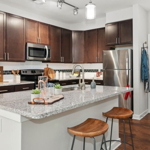 Beautiful kitchens with designer finishes a kitchen with a marble island