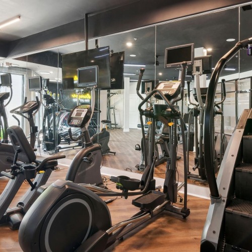 Cutting-edge amenities at your fingertips a gym with exercise equipment