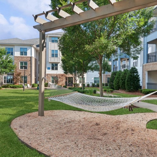 The essence of exceptional living a building with a grass lawn