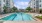 a swimming pool in a courtyard between buildings