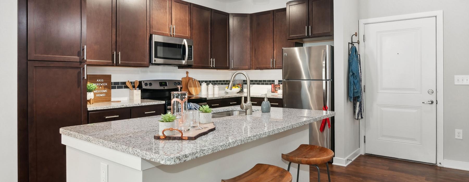 a kitchen with a marble island